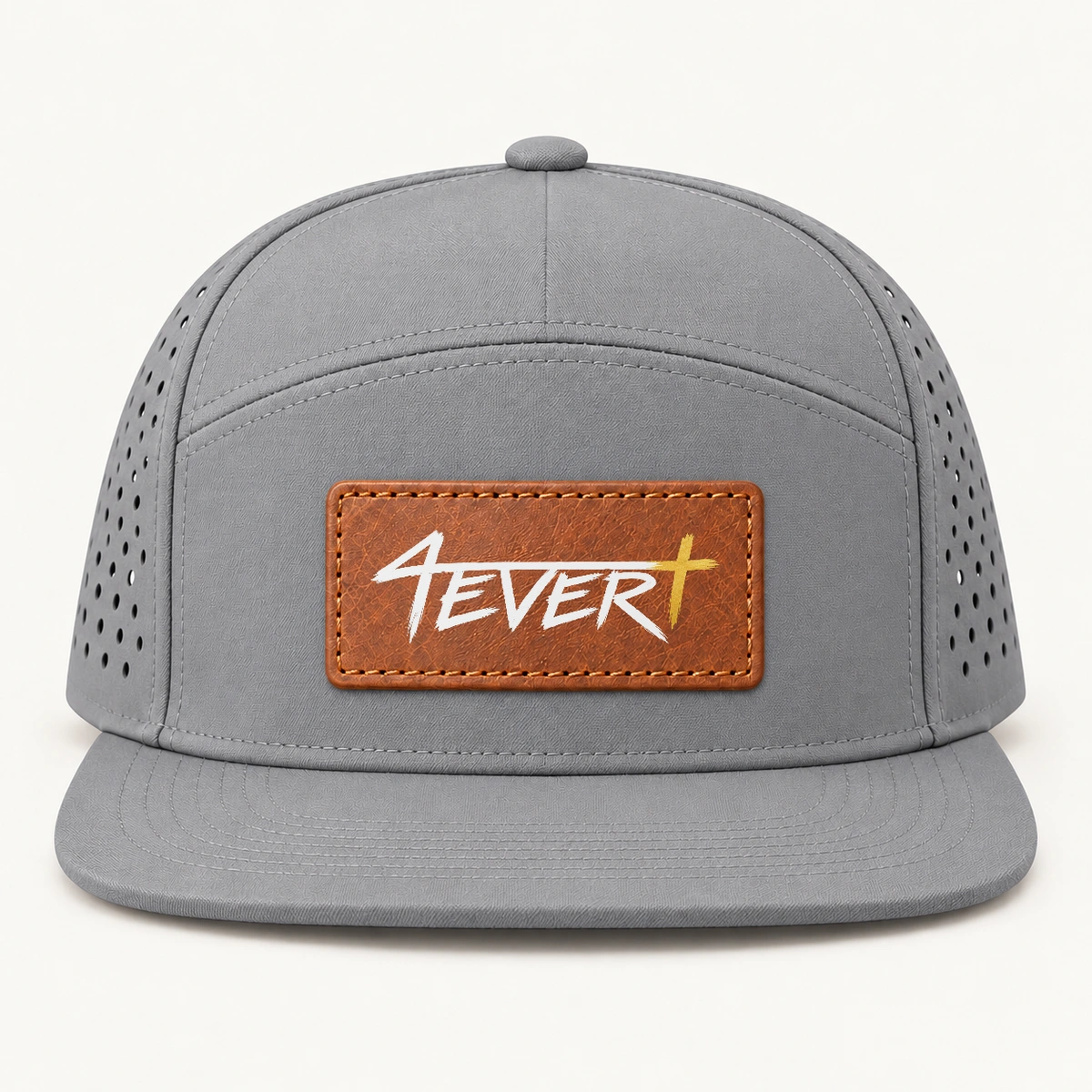 Grey — Flat-bill snapback with a centered brown stitched patch carrying the original white Forever wordmark and gold Christian cross; studio design preview